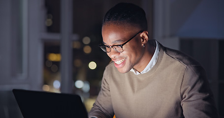 Image showing Businessman, night and laptop with smile in office, reading email with career progress in company. Black man, glasses and computer for happy in remote job, focus and internet research for strategy