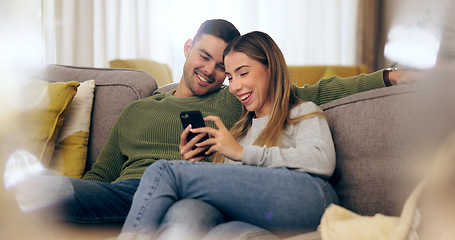 Image showing Relax, phone and couple on sofa for social media, internet and reading funny website together. Dating, home and man and woman on smartphone laugh for meme and bonding, happy and love in living room