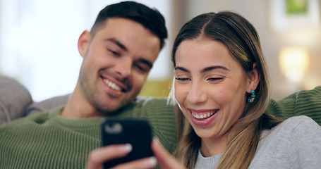 Image showing Laugh, phone and couple on sofa for social media, internet and reading funny website together. Dating, home and happy man and woman on smartphone for meme and bonding, relax and love in living room