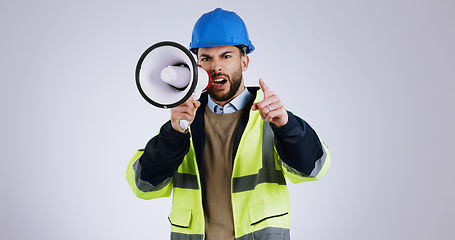 Image showing Angry man, architect and pointing with megaphone for construction or protest against a gray studio background. Portrait of male person, contractor or engineer shouting or screaming on loudspeaker