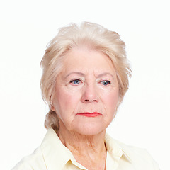 Image showing Reliving regrets. Closeup of a despondent senior woman isolated on white background.