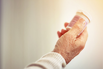 Image showing Medicine, woman and hands with a bottle of pills for recovery, health and wellness. Healthcare, medication and closeup of a senior female person with prescription tablets, supplements or vitamins.