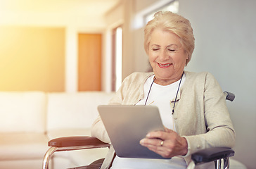 Image showing Happy, wheelchair and senior woman with a tablet, connection and typing with communication. Health, mature female person and elderly lady with recover, rehabilitation and technology for social media