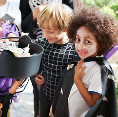 Image showing So much candy. Little children trick-or-treating on halloween.