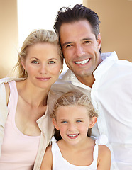 Image showing Family comes first. Two delighted parents spending time with their adorable daughter.