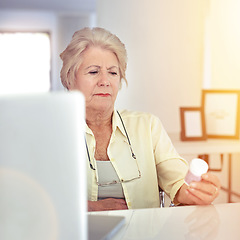 Image showing Gathering information on the medicine the doctor prescribed her. a senior woman checking her medication at home.