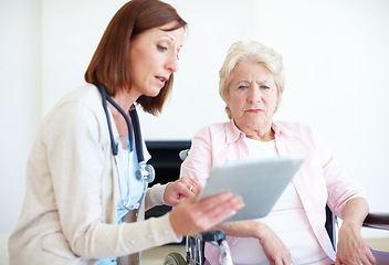 Image showing I have some concerns regarding your test results. Mature nurse explains the outcome of her elderly patients medical tests.