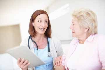 Image showing Reassurance in trying times - Senior Health. Mature nurse explains the outcome of her elderly patients medical tests.