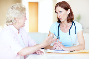 Image showing Professional advice from a trusted a physician - Senior Health. An elderly woman expresses her concerns to a trusted doctor.