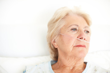 Image showing A heavy heart - Illness. Ailing senior woman wearing a nasal cannula looks out of her hospital window thoughtfully - Copyspace.