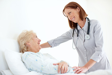 Image showing Her patients are important to her - Senior Care. Mature doctor pays her elderly female patient a visit following an operation.