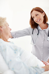 Image showing Conscientious healthcare for the elderly. Mature doctor pays her elderly female patient a visit following an operation.