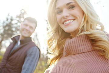 Image showing She enjoys nature walks. A happy and loving couple spending time out in the woods together.