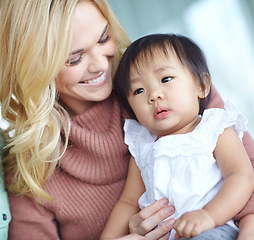 Image showing Shes such a gift. A beautiful blond woman spending time with her cute adopted daughter.