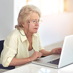 Image showing Staying in touch with all her friends. a senior woman using her laptop at home.