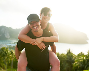 Image showing Love is a beautiful thing. a young man carrying his girlfriend on his back while holidaying together in Thailand.