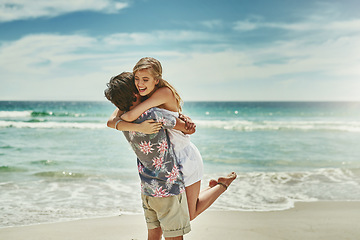 Image showing You make me so happy. an affectionate young couple embracing on the beach.