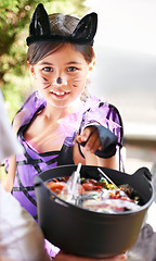 Image showing She loves dressing up. Little children trick-or-treating on halloween.