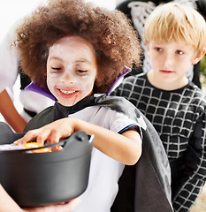 Image showing They love halloween. Little children trick-or-treating on halloween.