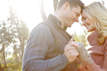 Image showing Shes the one. An affectionate and romantic young couple spending time together in the woods.