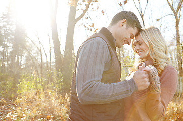 Image showing Hes the one. An affectionate and romantic young couple spending time together in the woods.