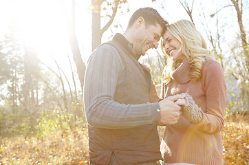 Image showing Sharing a special moment. An affectionate and romantic young couple spending time together in the woods.