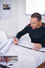 Image showing He takes great pride in the accuracy of his work. an architect drafting up building plans.