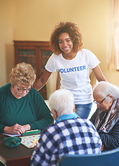 Image showing She enjoys giving a helping hand. a volunteer working with seniors at a retirement home.