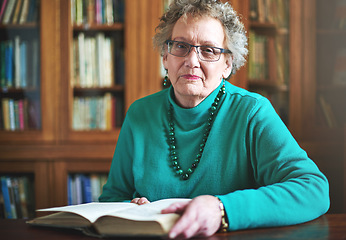 Image showing Reading keeps my mind sharp. Portrait of a senior woman sitting at a table reading.