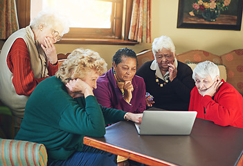 Image showing Tech savvy senior citizens. a group of senior women using a laptop at a senior centre.