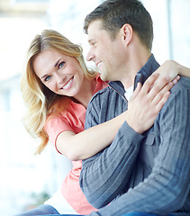 Image showing Hes my everything. an affectionate and happy mature couple spending time together while relaxing at home.