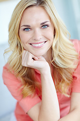 Image showing Fresh-faced natural beauty. Portrait of a beautiful young woman smiling and feeling cheerful at home.