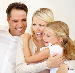 Image showing They adore each other. Two delighted parents spending time with their adorable daughter.