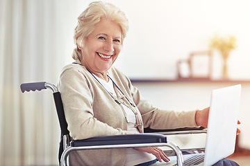 Image showing The trick to aging gracefully is to enjoy it. a senior woman using a laptop while sitting in a wheelchair.