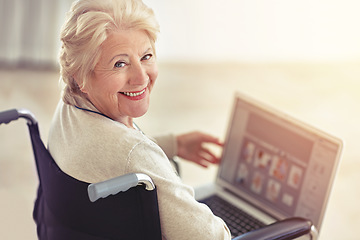 Image showing Shes a tech-savvy senior. a senior woman using a laptop while sitting in a wheelchair.