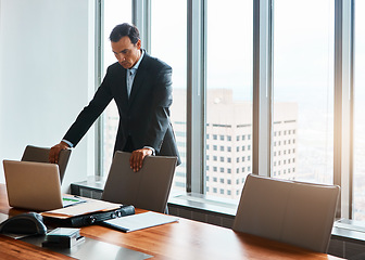 Image showing Risk taking is a must. mature businessmen working in a corporate office.