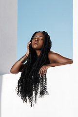 Image showing Look at those locks. an attractive young woman posing outside.