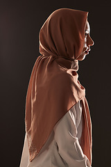 Image showing Muslim woman, profile and hijab in faith for religion, islam or praise against a dark studio background. Side view of Islamic female person or model with scarf in fashion for culture or tradition