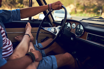 Image showing The lap of love. an affectionate young couple taking a roadtrip together.