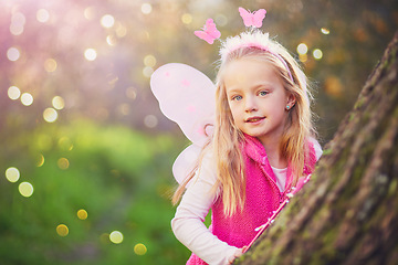 Image showing The innocence of childhood. Portrait of an adorable little girl dressed up as a fairy and having fun outside.