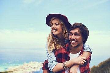 Image showing The view is worth the journey. an affectionate young couple enjoying a hike in the mountains.