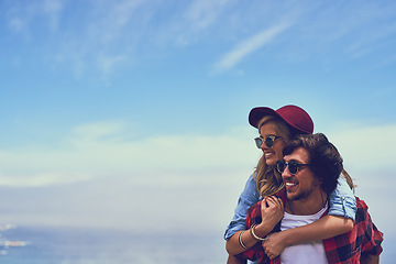 Image showing The view out here is incredible. an affectionate young couple enjoying a hike in the mountains.