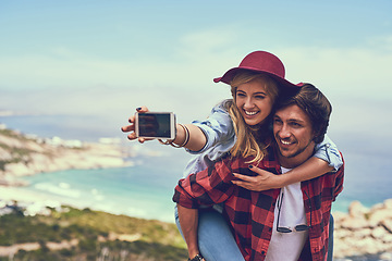 Image showing Smile. an affectionate young couple taking selfies while hiking in the mountains.