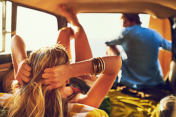 Image showing Adventurers at heart. Rearview shot of a young couple relaxing inside their car during a roadtrip.