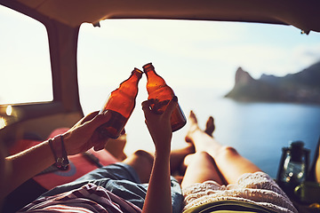 Image showing They dont need much to be happy. an unidentifiable young couple relaxing inside their car during a roadtrip.