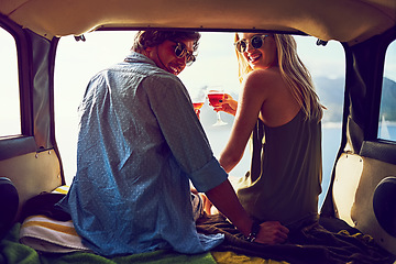 Image showing We love getting lost. Rearview shot of a young couple relaxing inside their car during a roadtrip.