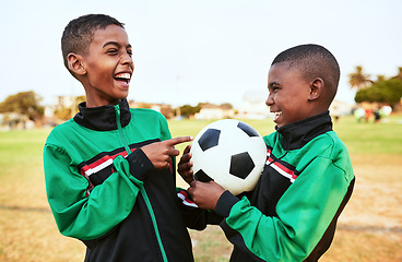 Image showing Playing a fun sport and making friends along the way. two young boys playing soccer on a sports field.