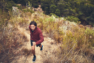 Image showing Run with your heart if your legs get tired. a young man out for a trail run.