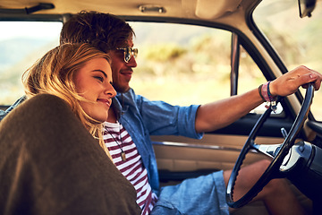 Image showing Safe by his side. an affectionate young couple taking a roadtrip together.