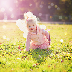 Image showing The cutest fairy has landed. Portrait of an adorable little girl dressed up as a fairy and having fun outside.